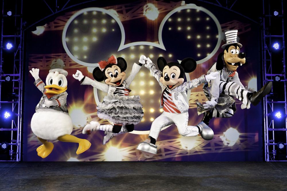 Donald, Minnie, Mickey and Goofy in silver and striped outfits on stage, Mickey's Music Festival. Costume design by Cynthia Nordstrom