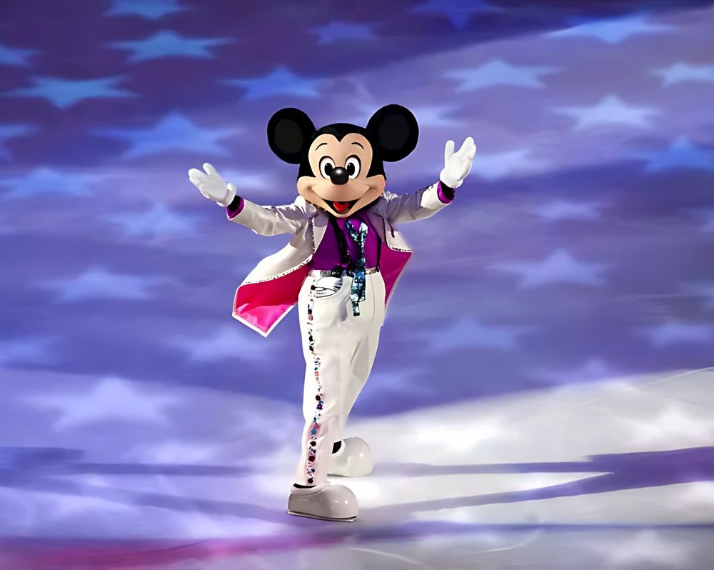 Mickey Mouse in a white and pink sequined tailcoat skating before stars, Rockin' Ever After. Costume design by Cynthia Nordstrom