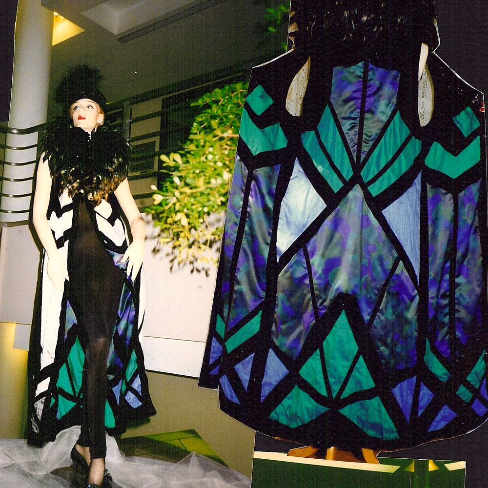 Two capes with stained glass panels in teal, blue and black, Fashion & Art. Costume design by Cynthia Nordstrom