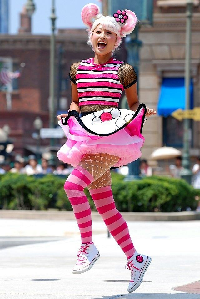 Happy Harmony Celebration: a parade performer in costume. Costume design by Cynthia Nordstrom