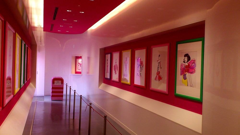 Corridor lined with framed fashion sketches in colored frames, Hello Kitty's Wonderland, USJ. Costume design by Cynthia Nordstrom