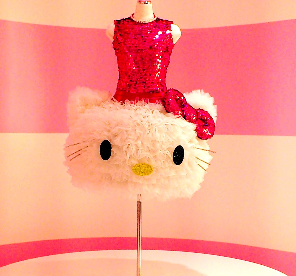 Red sequin dress with a fluffy white Hello Kitty face skirt, Hello Kitty's Wonderland, USJ. Costume design by Cynthia Nordstrom