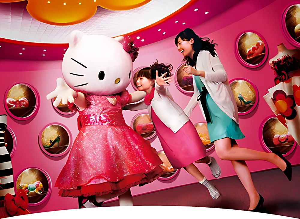 Hello Kitty in a pink sequin dress with guests in a pink gallery, Hello Kitty's Wonderland. Costume design by Cynthia Nordstrom