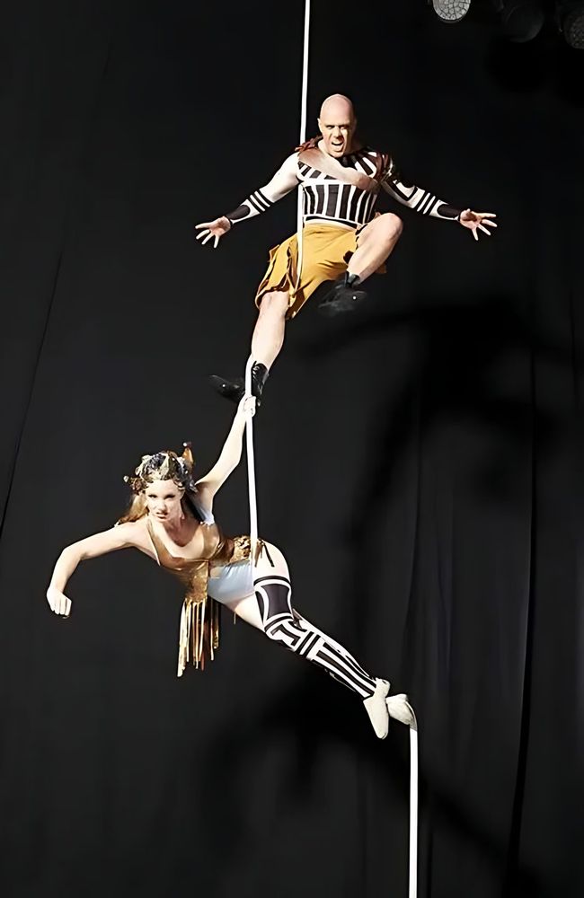 Aerial duo on ropes in gold and black and white striped costumes, Holiday On Ice: Speed. Costume design by Cynthia Nordstrom
