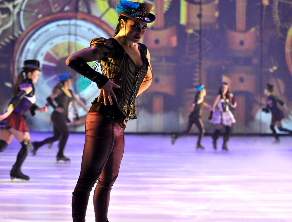 Steampunk skater in a brocade vest and goggles hat leading the ensemble, Holiday On Ice: Passion. Costume design by Cynthia Nordstrom