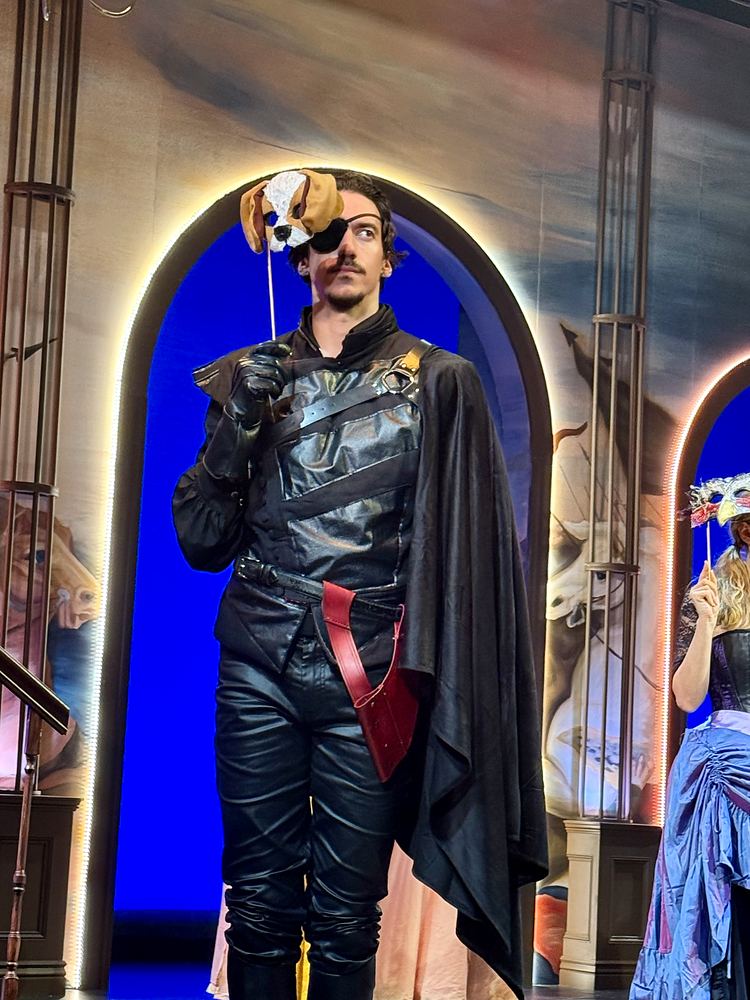 Man in black leather with an eye patch and black cape, The Three Musketeers. Costume design by Cynthia Nordstrom