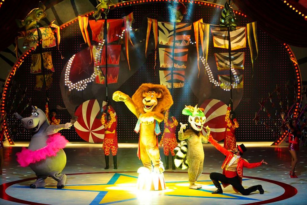 Madagascar Live! It’s Circus Time, Everland: Alex, Marty, Gloria and Melman with the penguins and King Julien on stage. Costume design by Cynthia Nordstrom