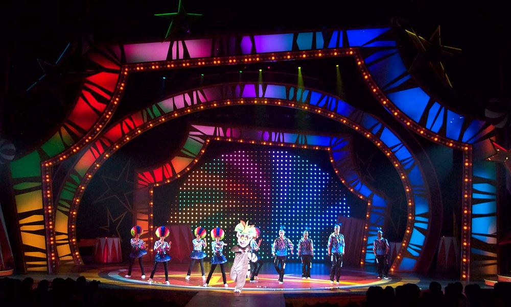Madagascar Live! It’s Circus Time, Everland: circus dancers with King Julien. Costume design by Cynthia Nordstrom