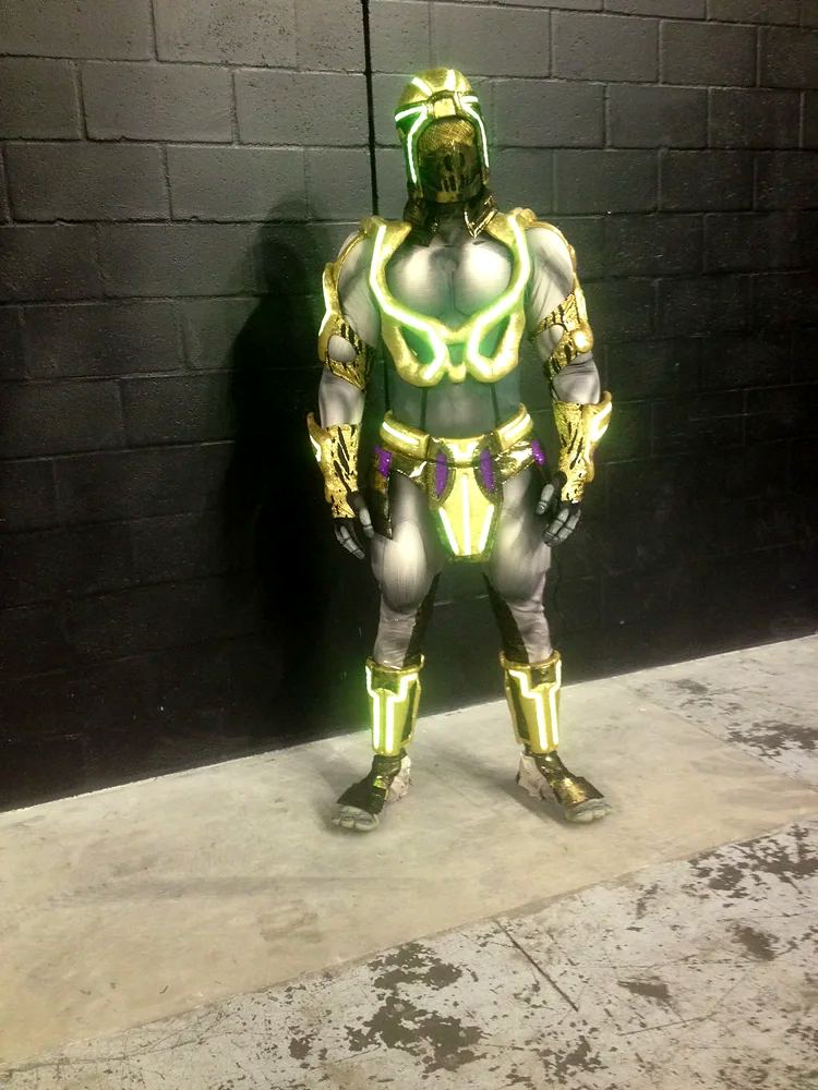 Marvel Universe Live: gold armored costume with glowing green trim, at a fitting. Costume design by Cynthia Nordstrom