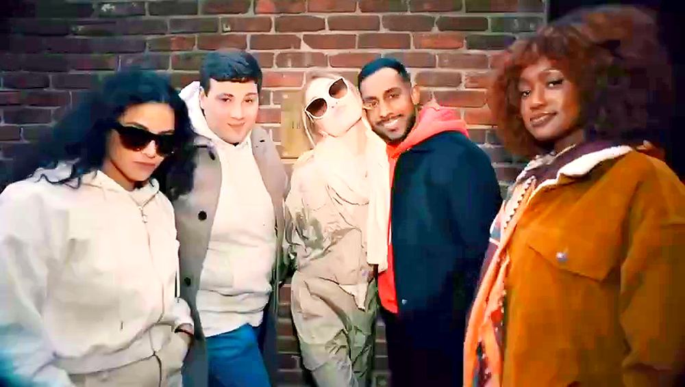 Five friends in casual streetwear posing against a brick wall, Motto by Hilton commercial. Wardrobe design by Cynthia Nordstrom