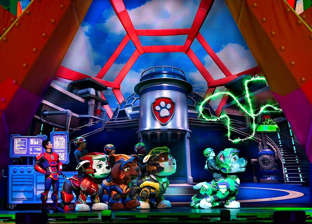 PAW Patrol Live! A Mighty Adventure: Ryder, Marshall, Zuma and Rubble cheer on Rocky in front of the PAW Patrol Lookout. Costume design by Cynthia Nordstrom
