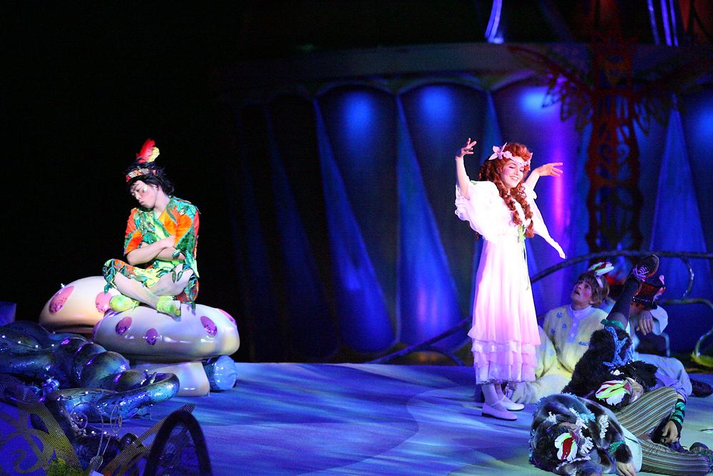 Wendy in a white nightgown and a performer in green on a mushroom, Peter Pan's Neverland, USJ. Costume design by Cynthia Nordstrom