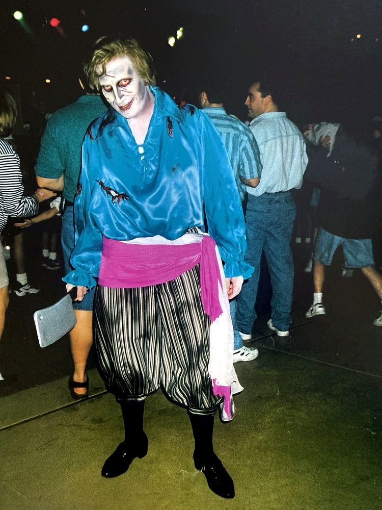 Pleasure Island, Downtown Disney: dancer in a teal jacket. Costume design by Cynthia Nordstrom