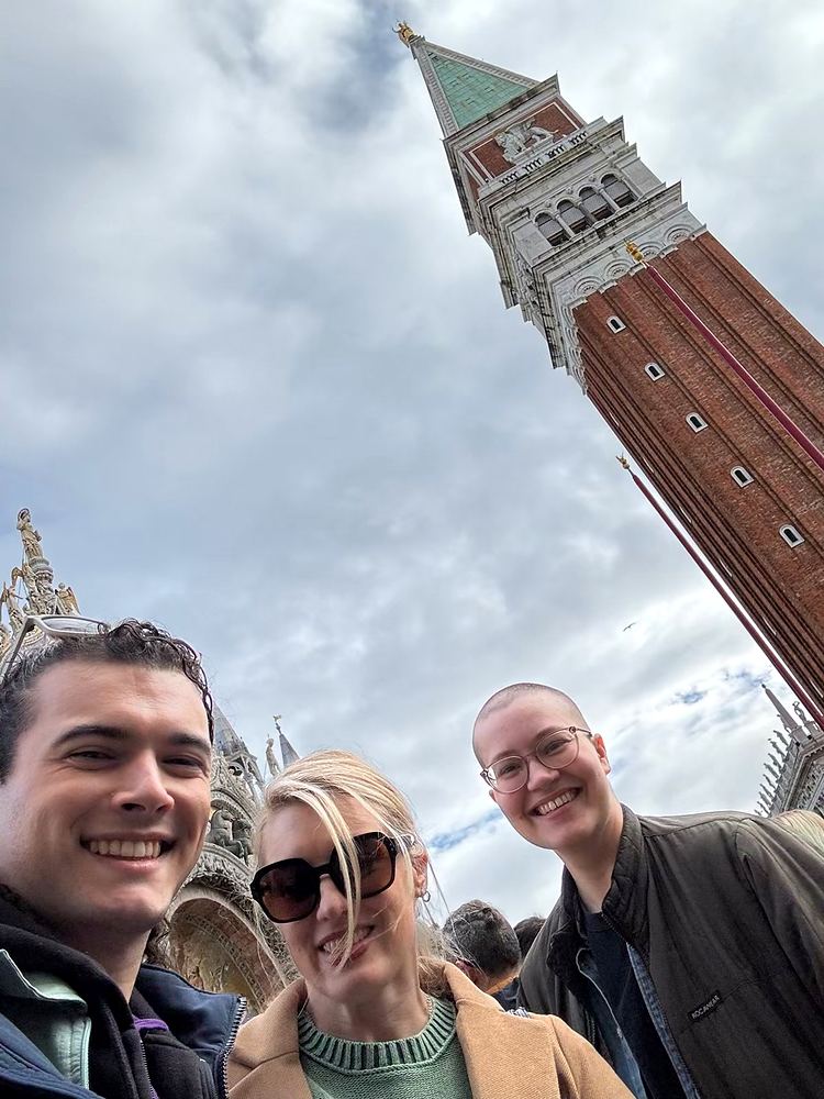 Selfie of Cynthia Nordstrom with friends beneath the bell tower in Venice