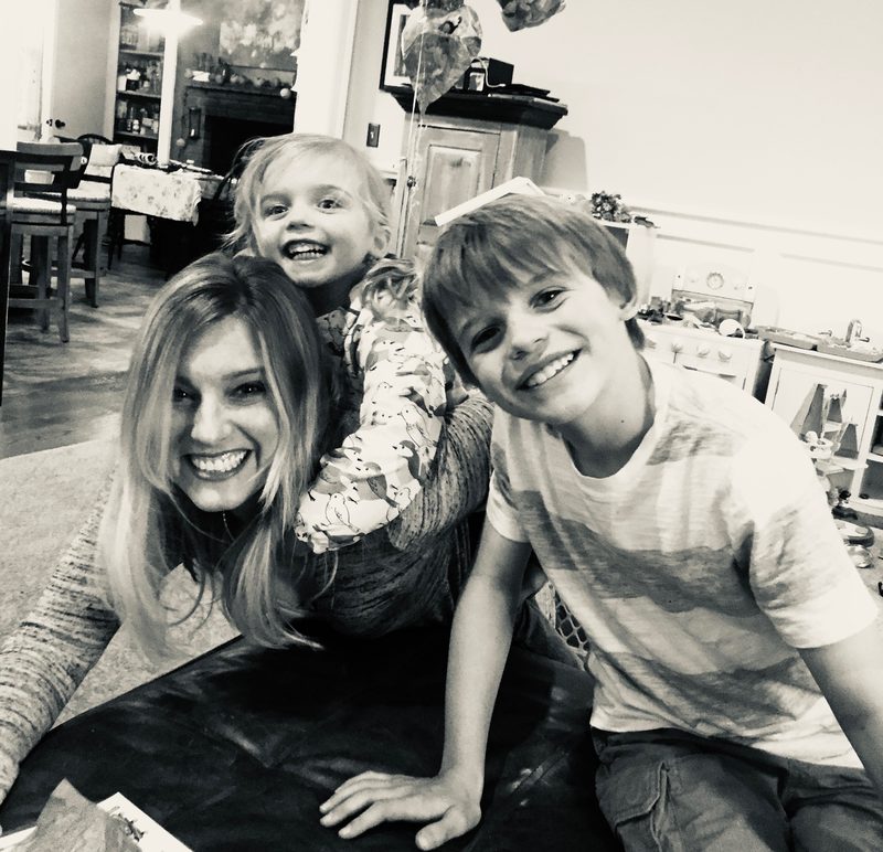 Cynthia Nordstrom cheek to cheek with her young child