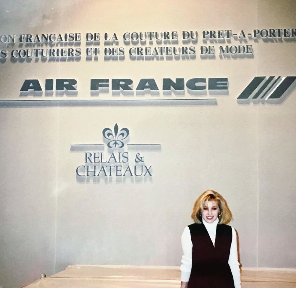 Cynthia Nordstrom at the World Haute Couture designer competition in Paris, in front of the Fédération Française de la Couture du Prêt-à-Porter wall