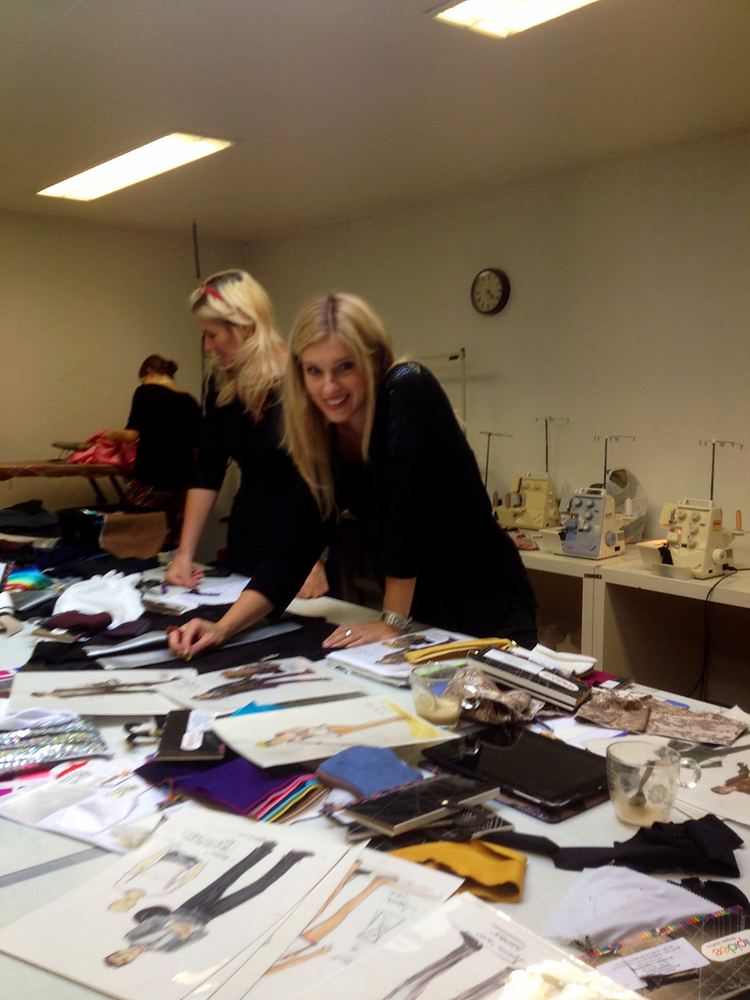 Cynthia Nordstrom and a colleague working at a table covered with patterns and fabric