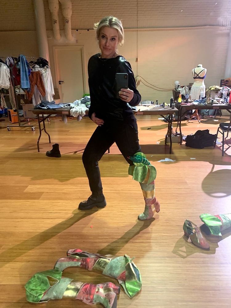 Cynthia Nordstrom striking a playful pose in a rehearsal studio