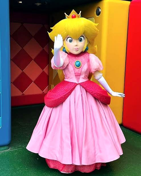 Princess Peach in her costume at Super Nintendo World, Universal Studios Japan. Costume design by Cynthia Nordstrom. Costume design by Cynthia Nordstrom