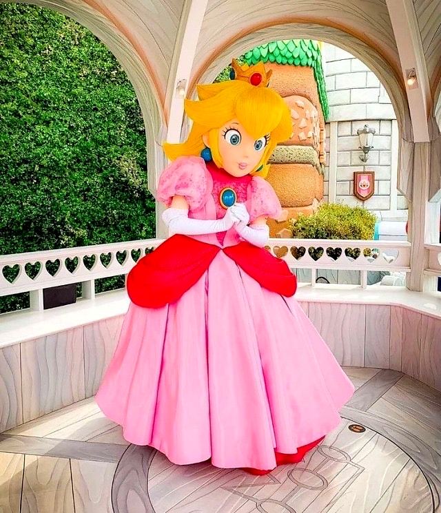 Princess Peach walkaround character in the Super Nintendo World gazebo. Costume design by Cynthia Nordstrom