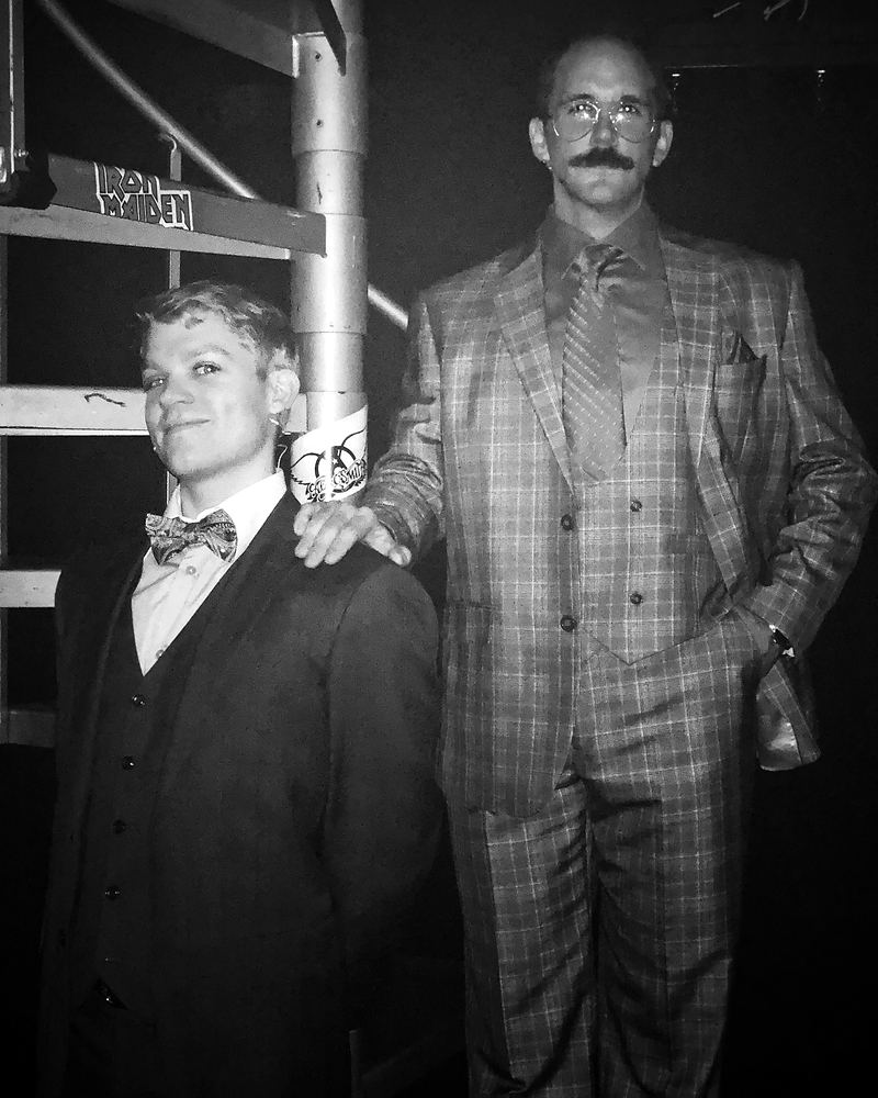 Two men in a tuxedo with bow tie and a plaid three-piece suit, Rock of Ages. Costume design by Cynthia Nordstrom