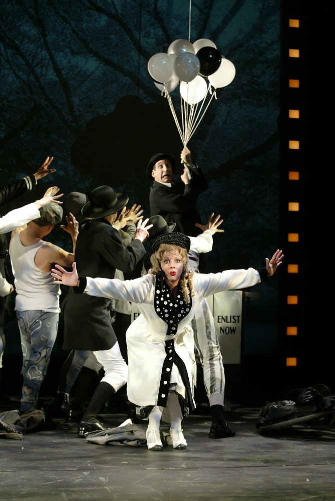 Woman in a black and white dress with ensemble and balloons in silent film style, Silent Laughter. Costume design by Cynthia Nordstrom