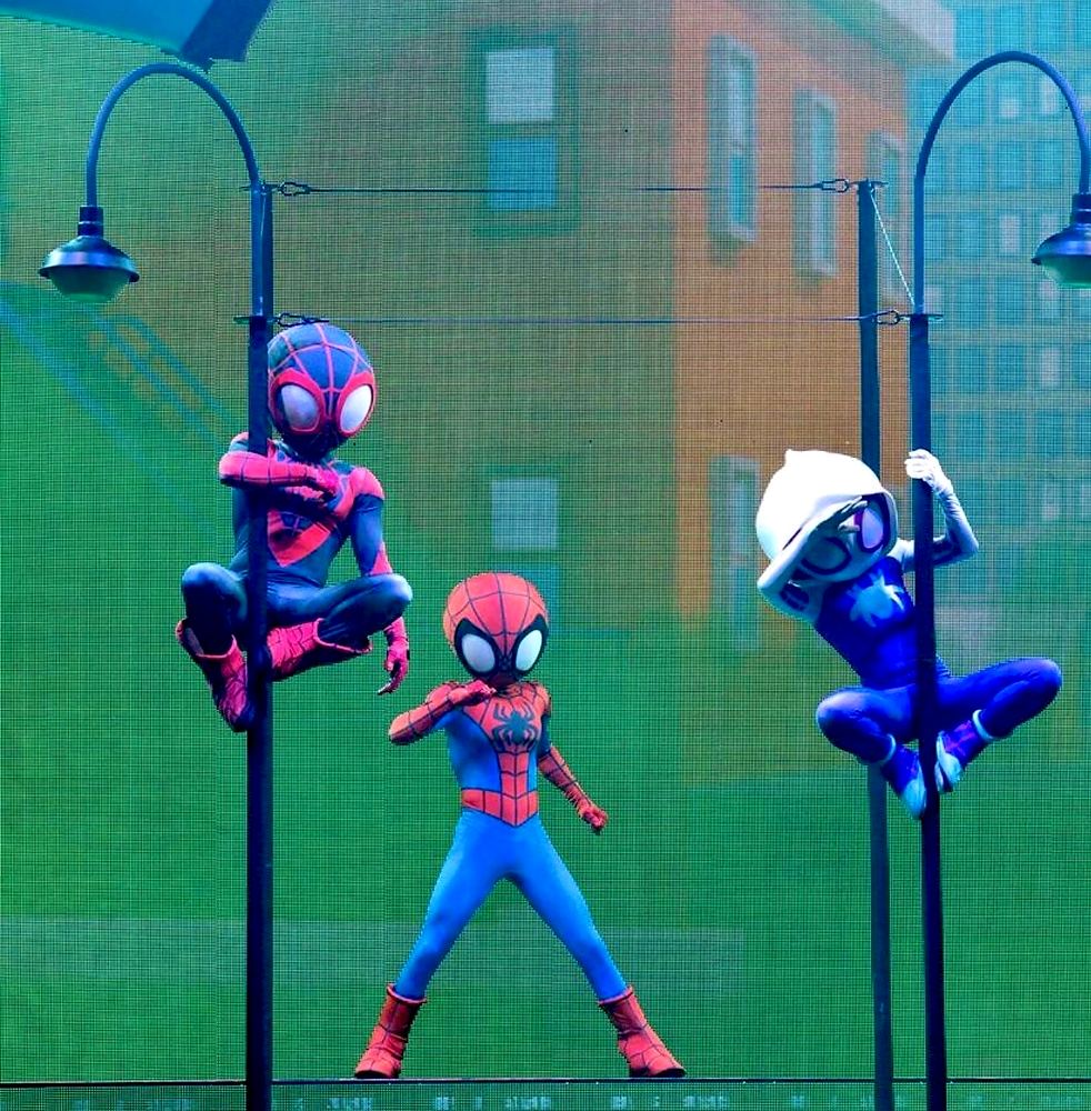 Disney Junior Live On Tour: Costume Palooza: Spidey, Spin and Ghost-Spider on lamp posts on stage. Costume design by Cynthia Nordstrom
