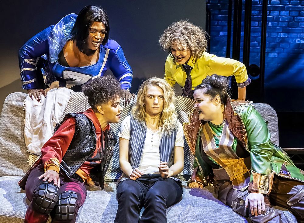 SuperYou at Curve, Leicester: a hero in a bright costume onstage. Costume design by Cynthia Nordstrom