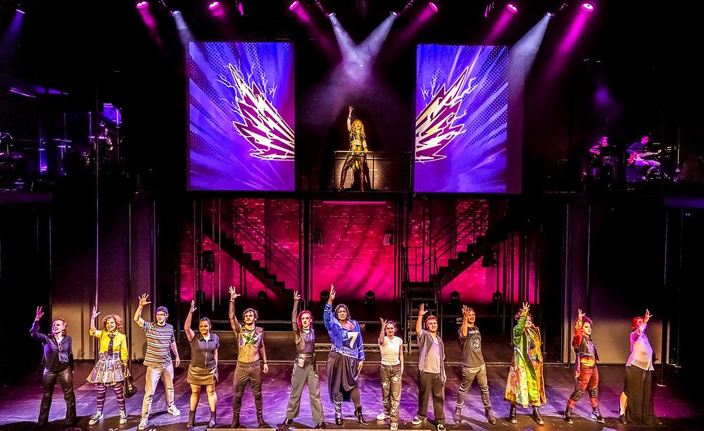 SuperYou at Curve, Leicester: the company in superhero costumes. Costume design by Cynthia Nordstrom