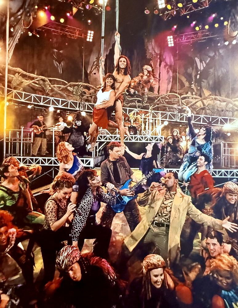 Tarzan Rocks! at Disney’s Animal Kingdom: the full cast on the Theater in the Wild stage. Costume design by Cynthia Nordstrom