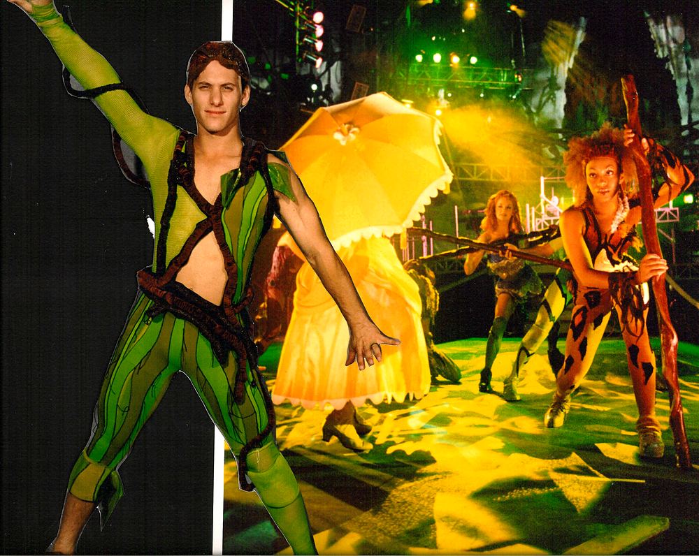 Tarzan in a green harness costume mid-pose with Jane and dancers behind, Tarzan Rocks!. Costume design by Cynthia Nordstrom
