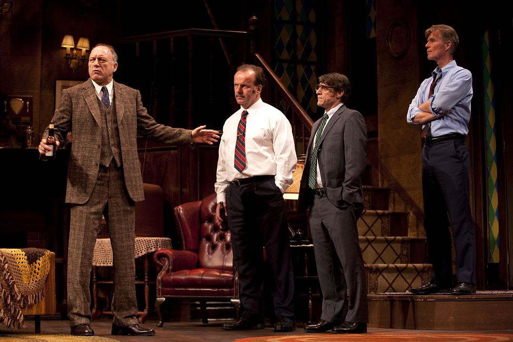 Four men in 1970s suits and shirtsleeves in a wood-paneled living room, That Championship Season. Costume design by Cynthia Nordstrom