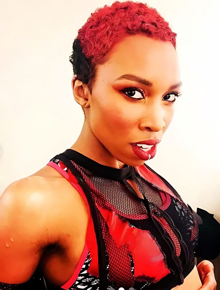 Ultimate Tag: the Banshee Tagger in her red costume. Costume design by Cynthia Nordstrom
