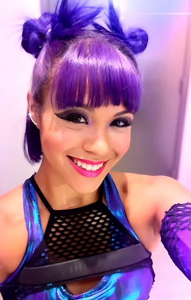 Ultimate Tag: a Tagger with purple hair at a costume fitting. Costume design by Cynthia Nordstrom