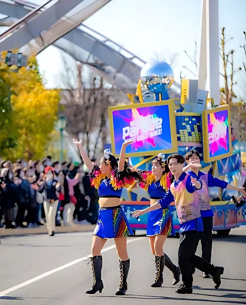 Dancers in iridescent blue and purple tops, shorts and boots marching, NO LIMIT! Parade, USJ. Costume design by Cynthia Nordstrom
