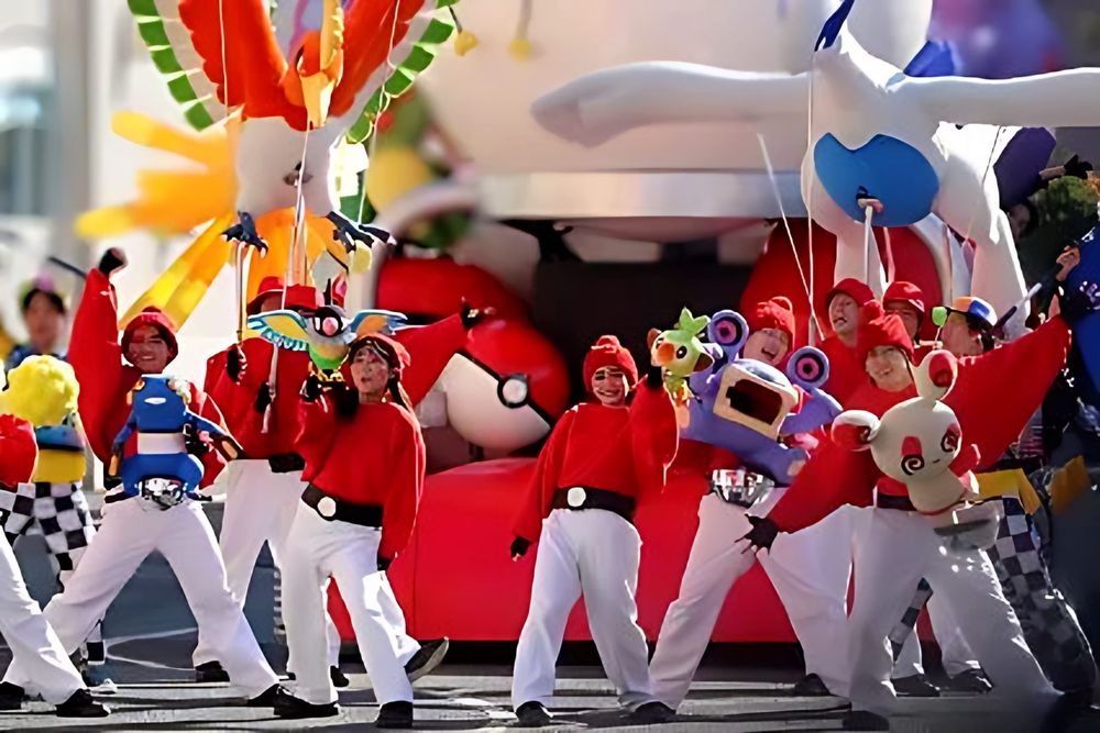 Pokemon section dancers in red jackets and white pants with characters, NO LIMIT! Parade, USJ. Costume design by Cynthia Nordstrom