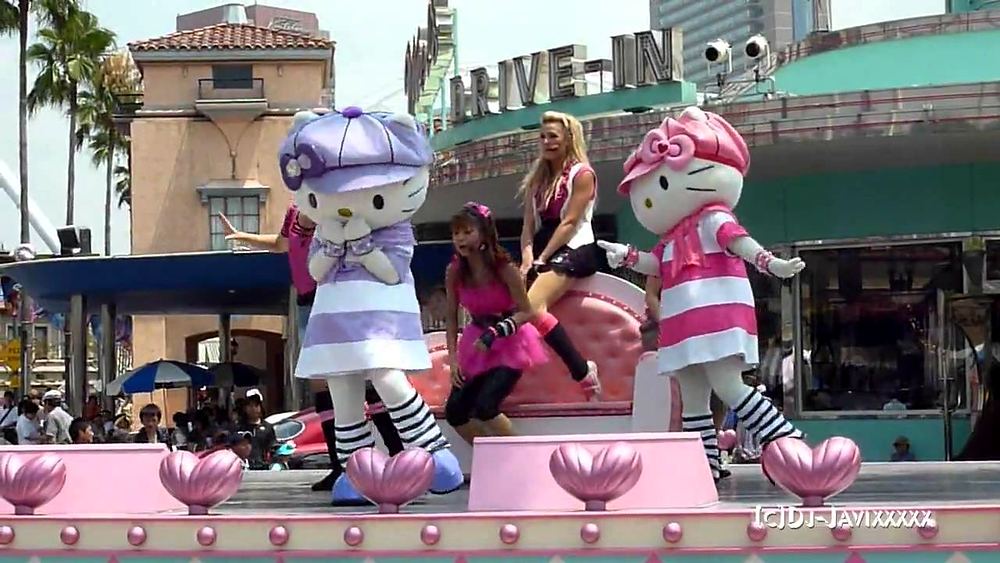Hello Kitty characters in purple and pink outfits on a parade float, USJ anniversary shows. Costume design by Cynthia Nordstrom